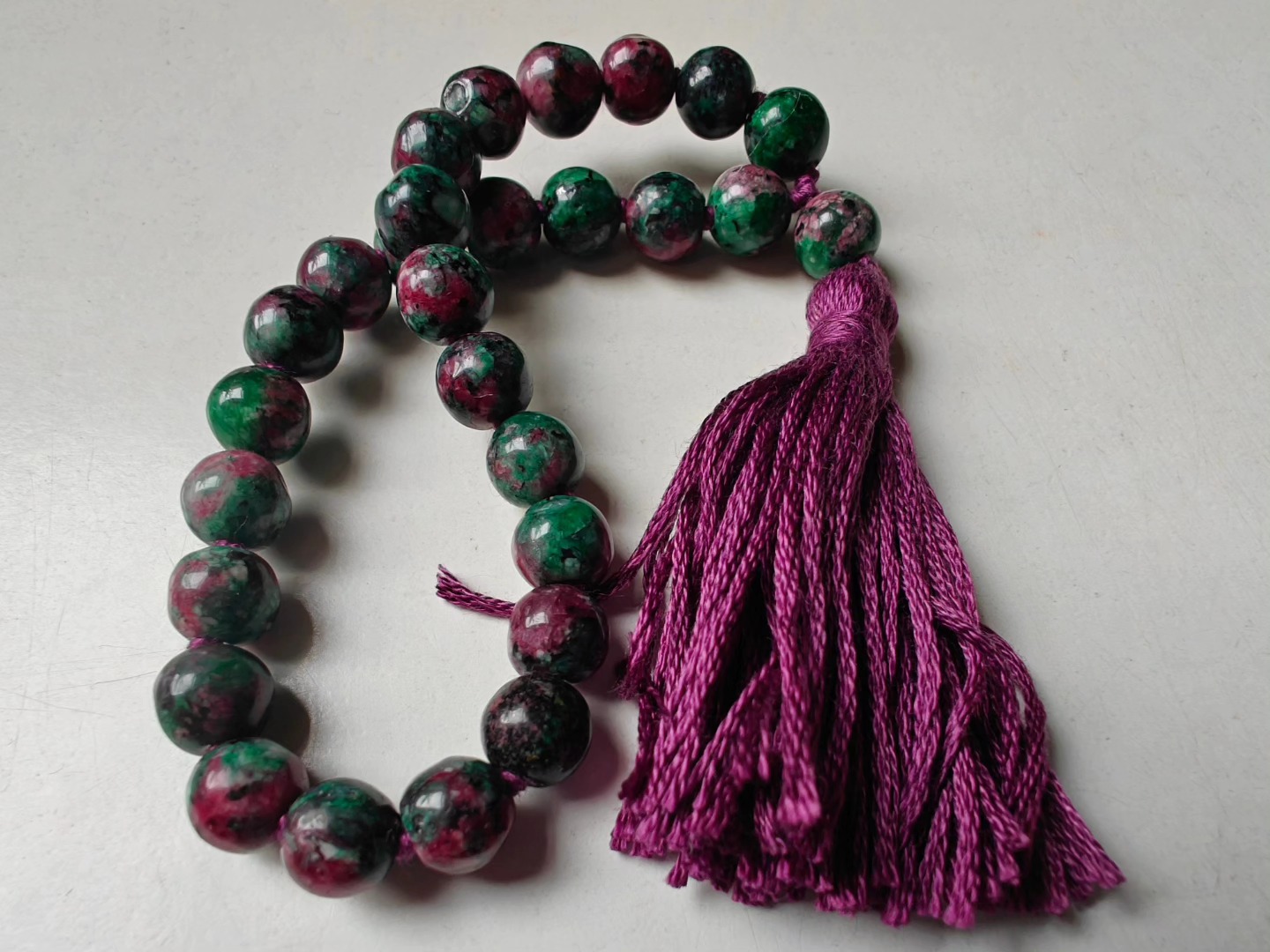 27 bead 8mm Ruby-Zoisite (aka Anyolite) Mala on dark grape coloured thread